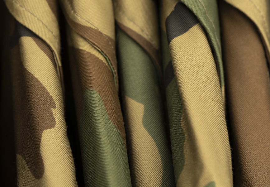 uniforms neatly hung in military storage